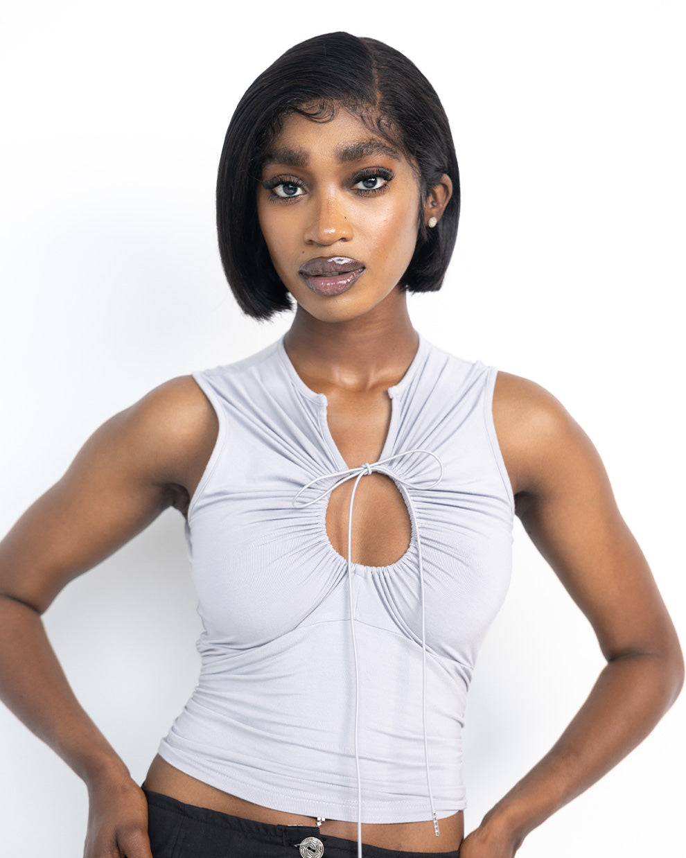 Grey keyhole tank top by DORMELEVEN, featuring a stylish keyhole neckline and sleeveless design, laid flat on a white background.