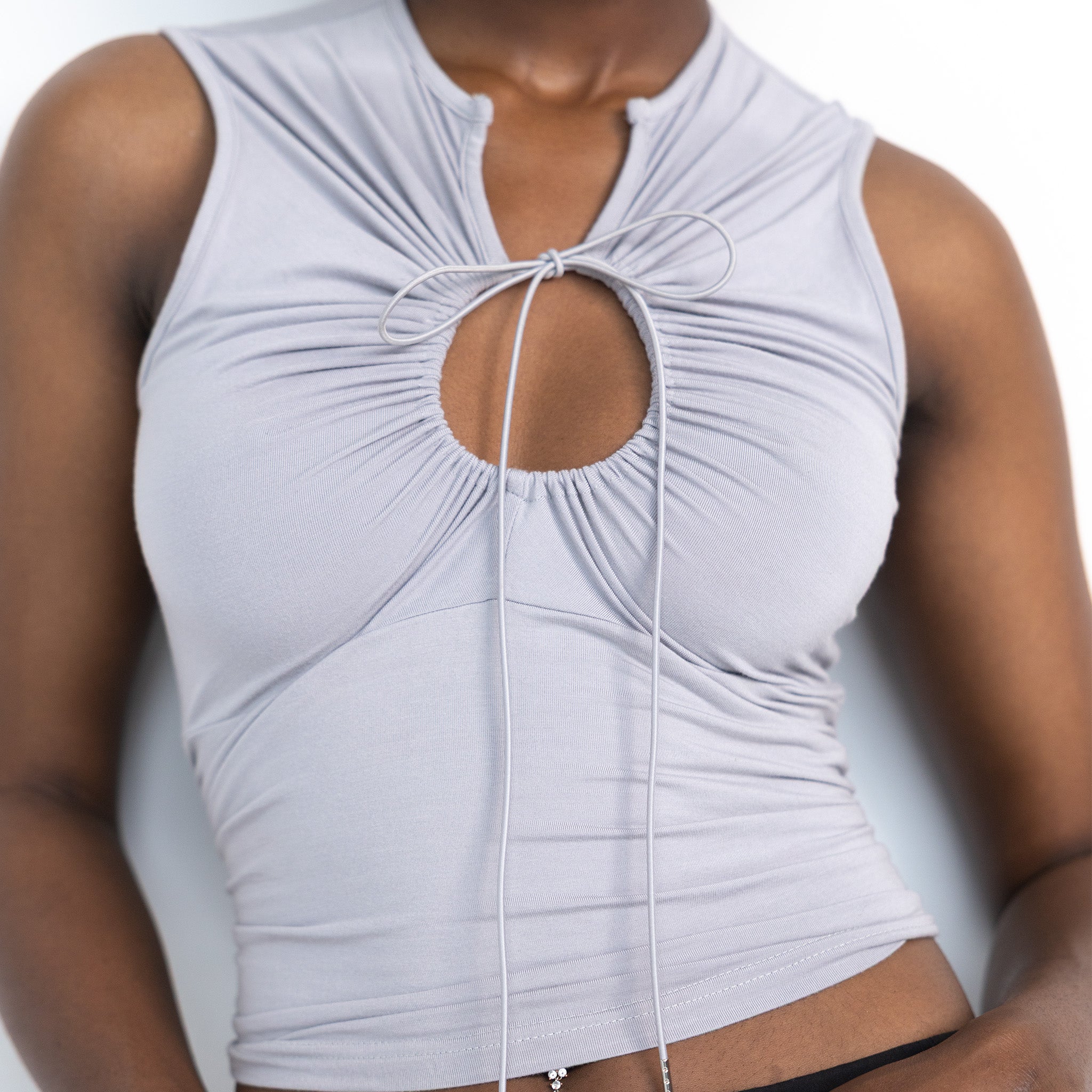 Gray keyhole tank top by Dormelevens, featuring a stylish keyhole detail at the neckline and a relaxed fit.